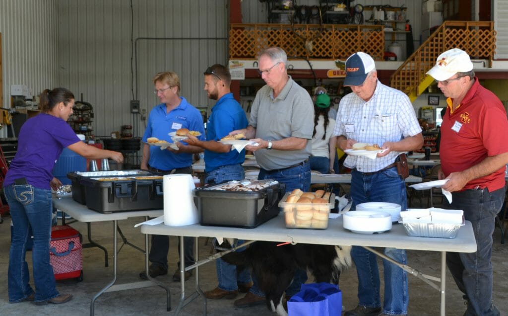 Guests enjoy barbecue pork sandwiches for lunch