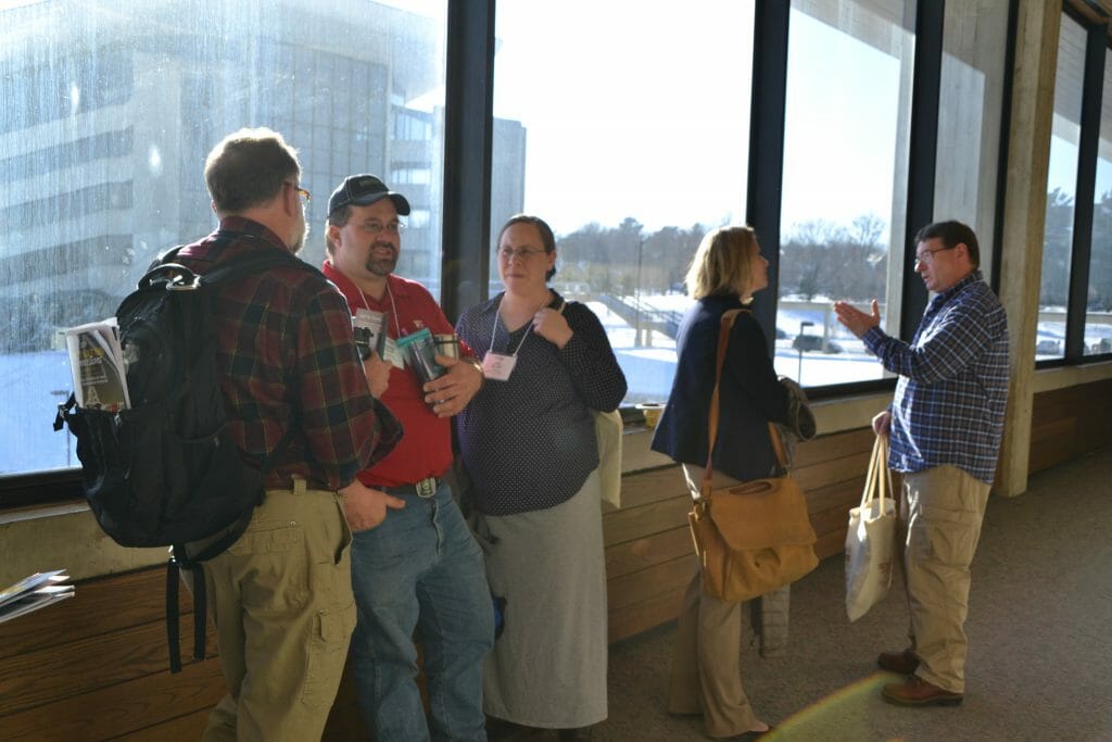 attendees of practical farmers of iowa annual conference networking between sessions