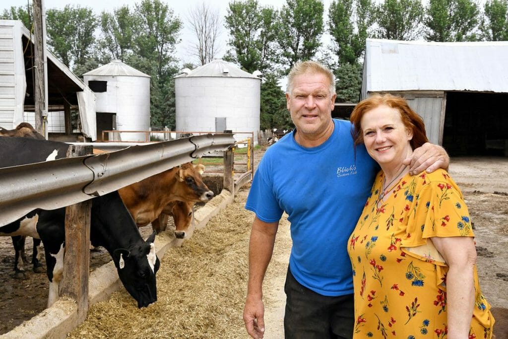 dairy cattle farmers Daryl and Marla De Groot with their dairy cattle on their farm near Hull Iowa