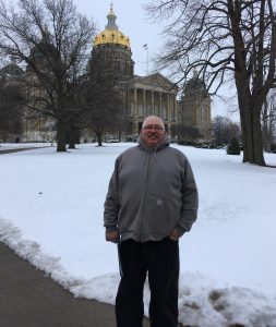 farmer Fred Abels stands outside of the Iowa capitol in des moines