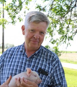 Ron with piglet