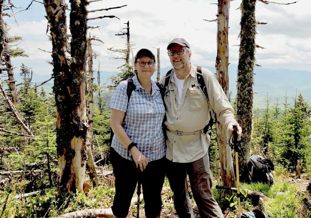 Linda Barnes and Mark Runquist hiking in New England lighting fix