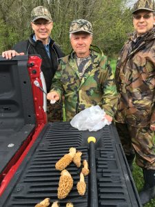 Iowa hunters pose with mushrooms