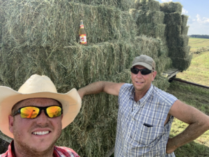 Tracy Skaar (right) after a day of stacking hay bales