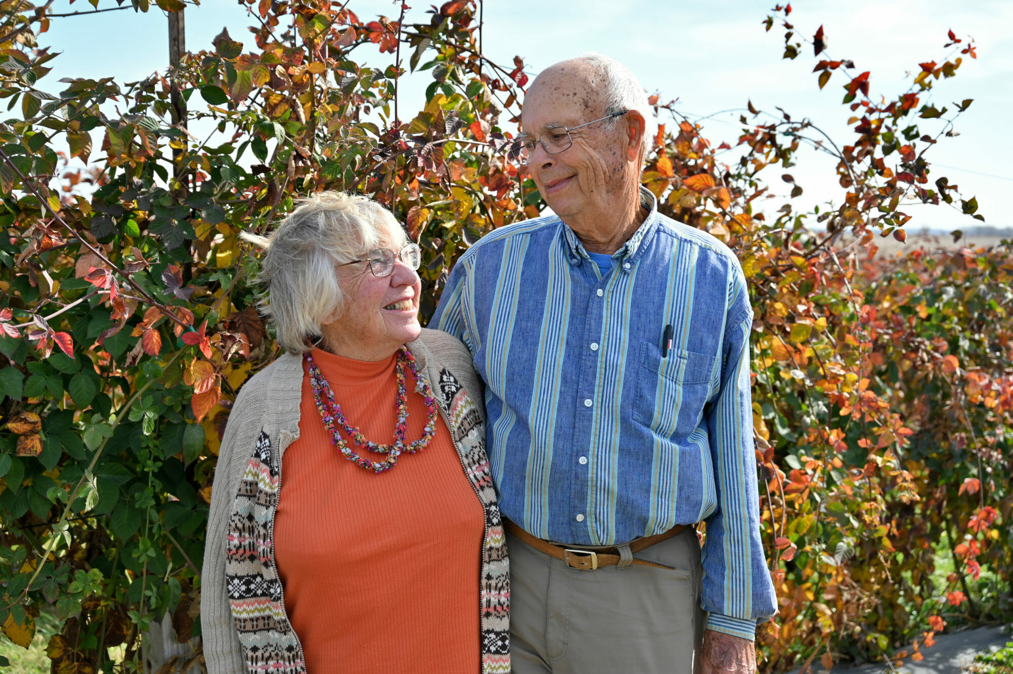 Dean and Judy Henry standing outside on their farm.