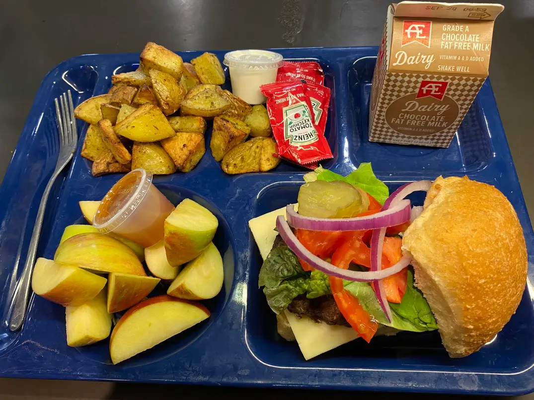 Blue food tray featuring locally grown Iowa foods at Decorah Schools.