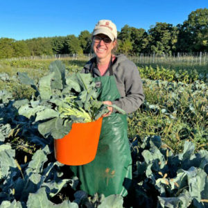 Kate Edwards harvesting broccoli