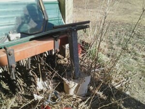 Why deal with hammering endposts into frozen ground? Fred filled flowerports with cement and inserted a wood or metal post from which to attach reels and fence.