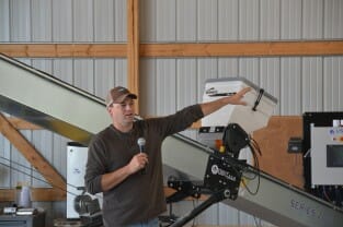 Jay Lynch discusses the facility on the farm they use to treat seed themselves.