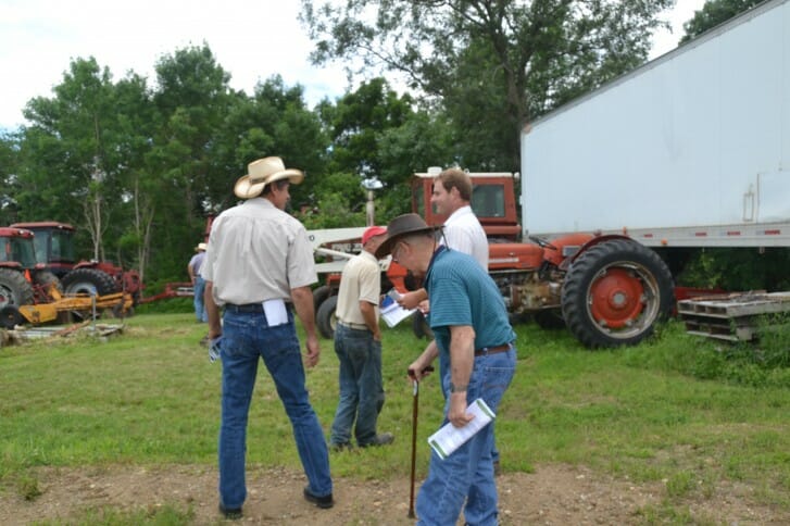 Attendees chat at Wade Dooley's field day.
