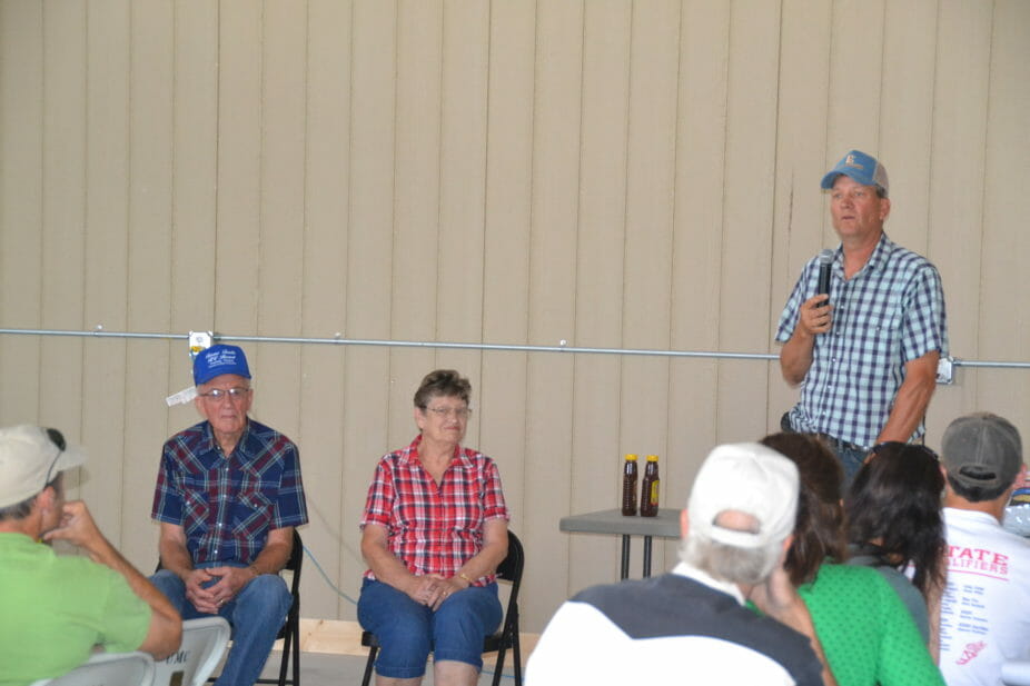 Bob, with parents Larry and Esther, talk to the group about how they've transferred the farm across the generations.