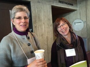 Jan Libbey, left, visits with Ann Franzenburg at Practical Farmers 2015 annual conference