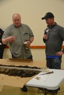 Jack Boyer left) and Neil Sass of the NRCS discuss some deep soil cores pulled from some of Jacks cover crop fields.
